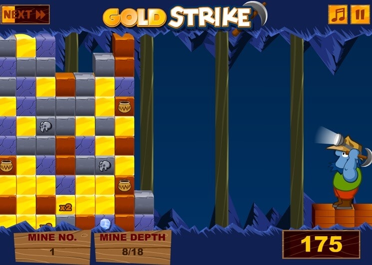 Zuma Gold Strike 1 Gold Strike game with blocks, mine traps, and a character in the forest.